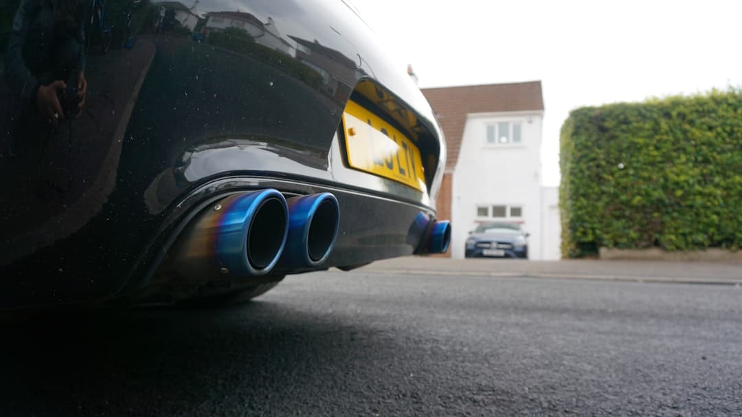 Close-up of blue exhaust pipes on a car.